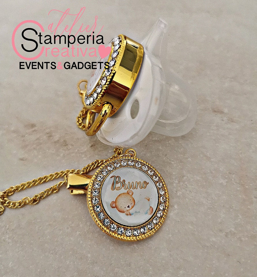 Ciuccio bianco/oro completo di catenella